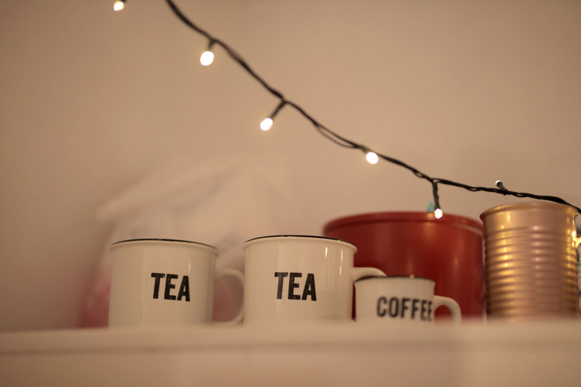A cozy home kitchen with a mug, soft light, and a simple after-work setup
