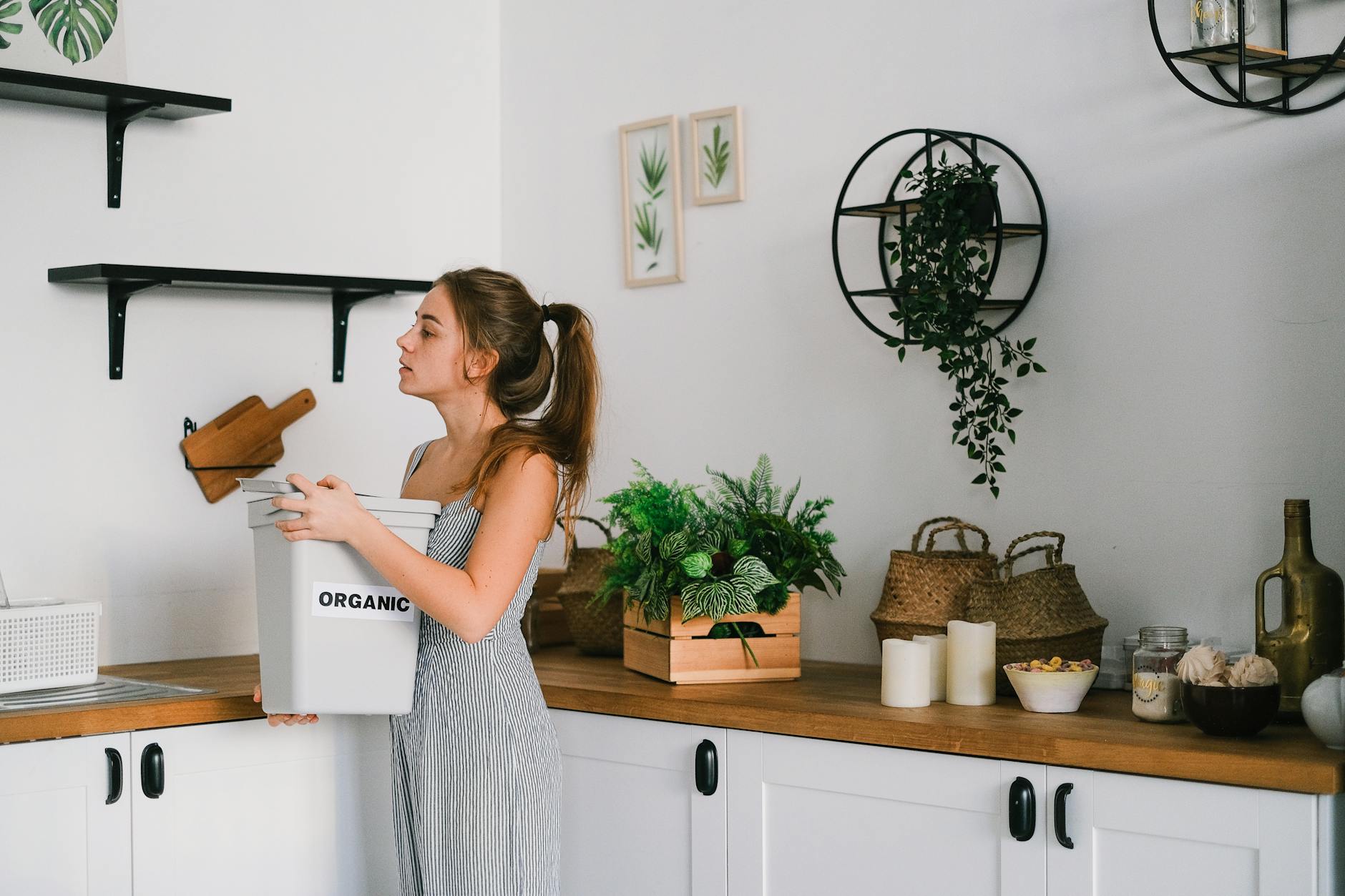 A cozy kitchen with organized countertops and a functional entryway featuring a bench and storage bins.