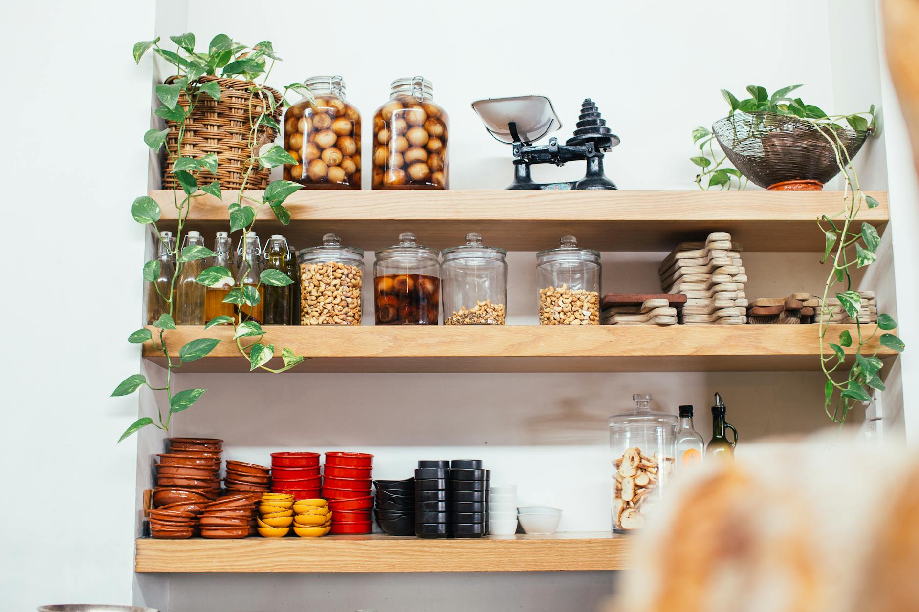 warm pantry shelves with labeled containers and everyday kitchen staples