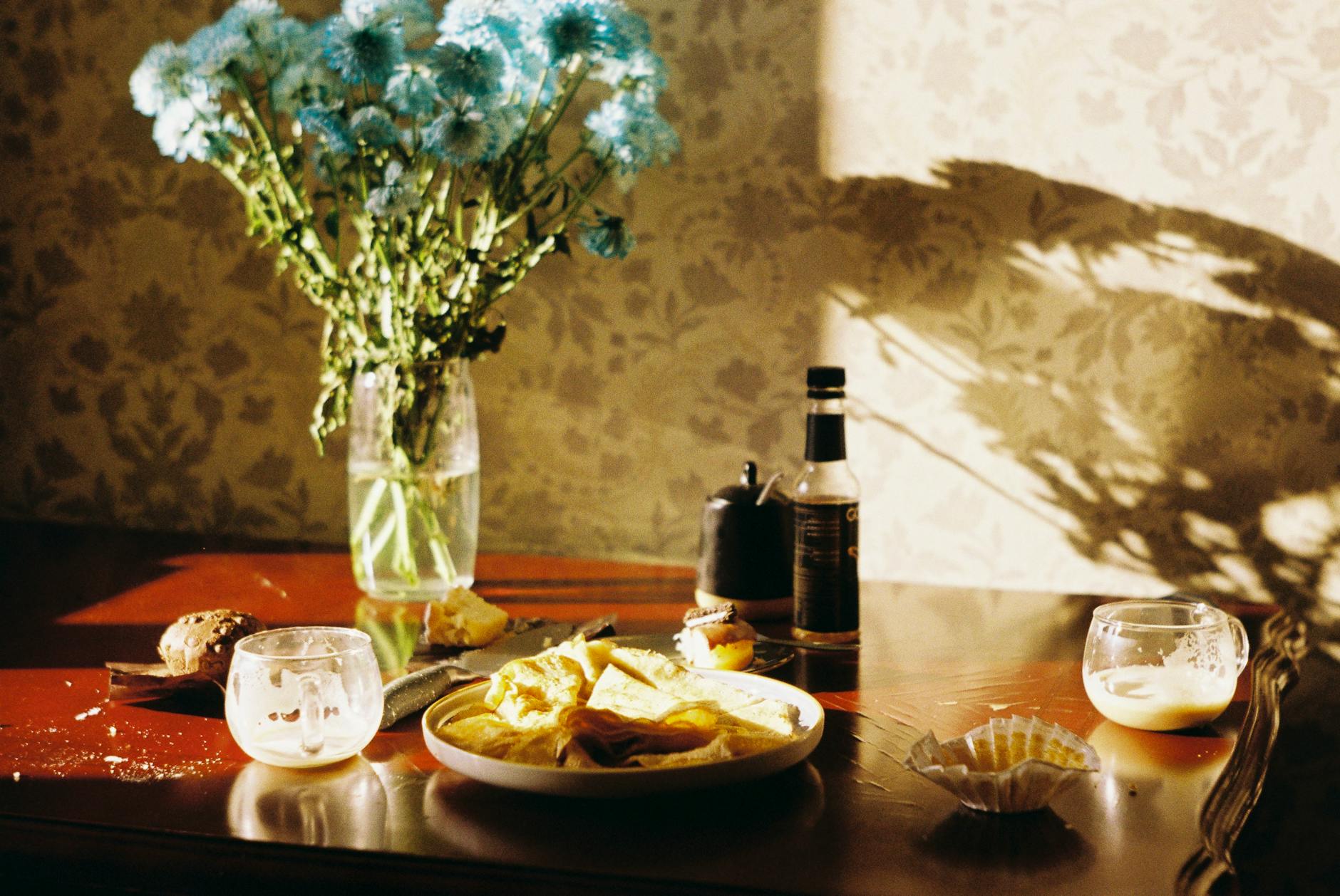A calm kitchen breakfast setup with simple dishes and soft morning light